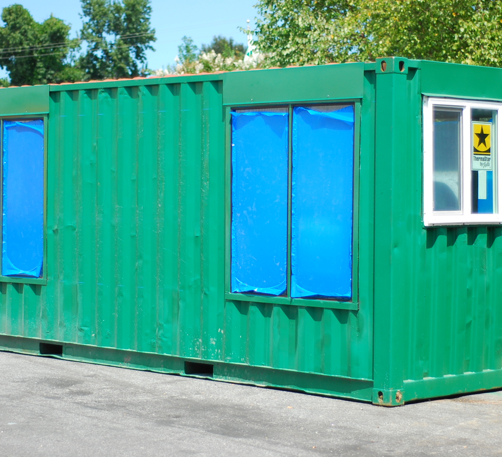 Green custom container with windows for alternative usage
