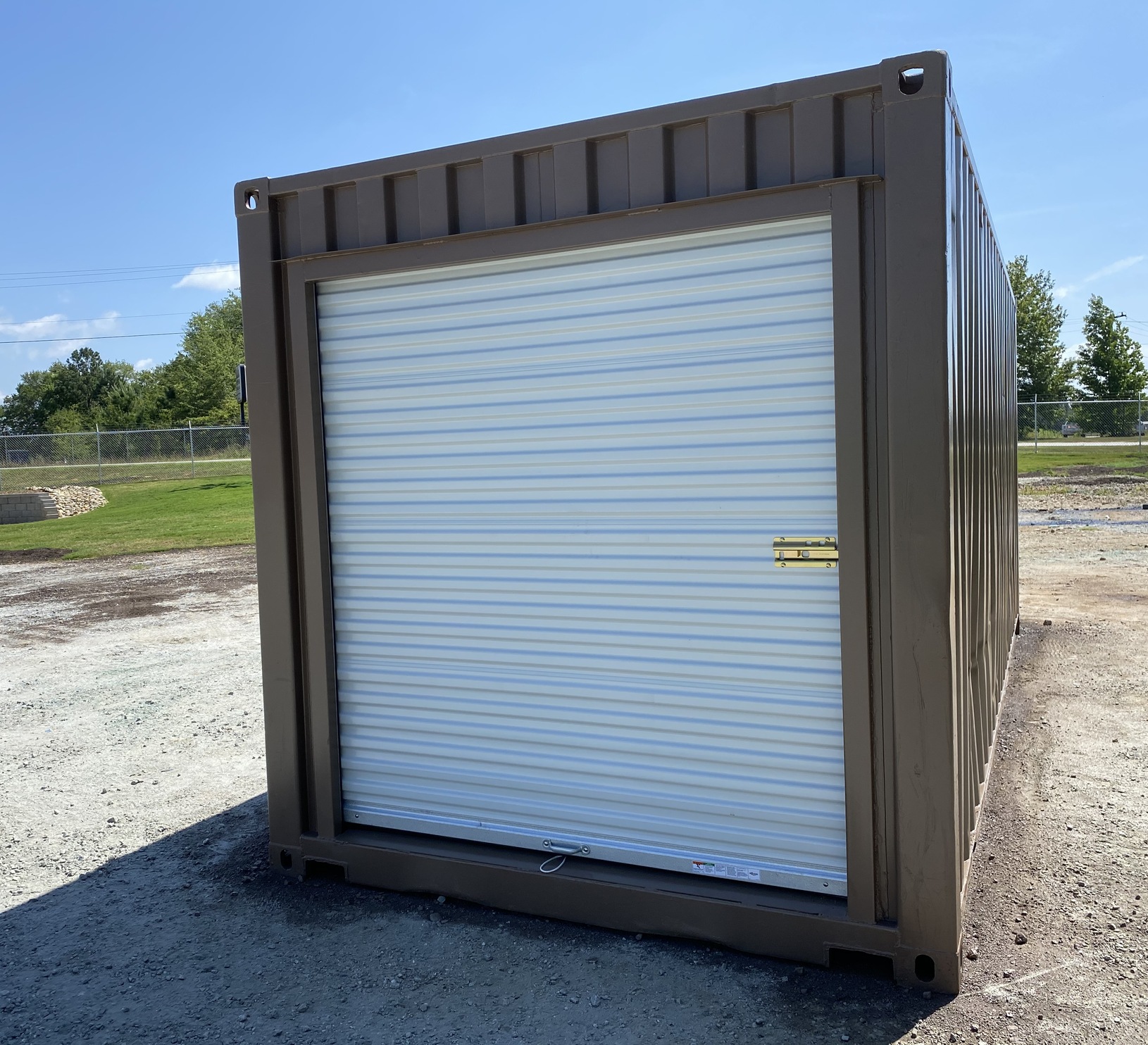 Storage container with roll up door